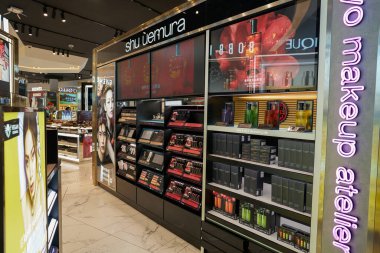 PHUKET, THAILAND - MAY 09, 2023: Shu Uemura make-up products displayed at duty-free area in Phuket International Airport. clipart