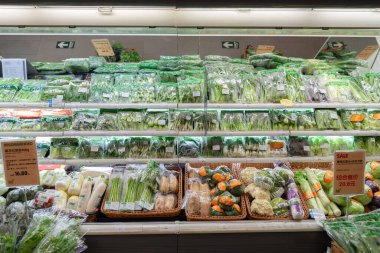 SHENZHEN, CHINA - JANUARY 10, 2017: produce on display at blt supermarket in Longgang Vanke Plaza shopping mall. clipart