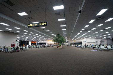 BANGKOK, THAILAND - OCTOBER 14, 2023: interior shot of Don Mueang International Airport terminal. clipart