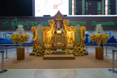 BANGKOK, THAILAND - OCTOBER 14, 2023: King Rama IX portrait on display at Don Mueang International Airport. clipart