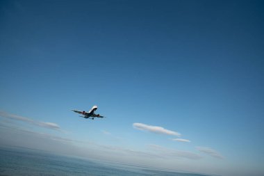 PHUKET, THAILAND - JANUARY 23, 2020: an Azur Air Boeing 757-200 aircraft landing at Phuket International Airport. clipart