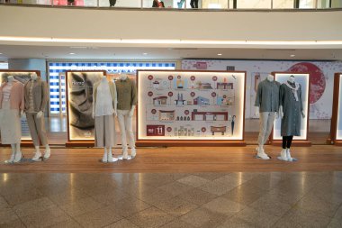 KUALA LUMPUR, MALAYSIA - MARCH 15, 2023: dressed mannequins on display at Mid Valley Megamall.  clipart