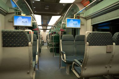 KUALA LUMPUR, MALAYSIA - MARCH 21, 2023: interior shot of KLIA Ekspres train. KLIA Ekspres is an express airport rail link servicing the Kuala Lumpur International Airport. clipart