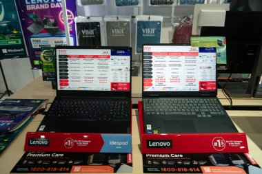 KUALA LUMPUR, MALAYSIA - MARCH 12, 2023: laptops on display at TMT store at Plaza Low Yat mall in Kuala Lumpur clipart