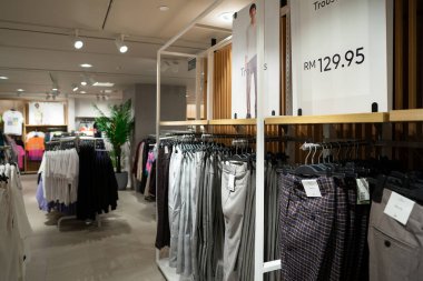 KUALA LUMPUR, MALAYSIA - MARCH 15, 2023: interior shot of H and M store in Kuala Lumpur clipart