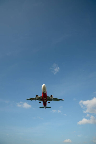 PHUKET, THAILAND - JANUARY 22, 2020: an AirAsia Airbus A320 aircraft landing at Phuket International Airport.