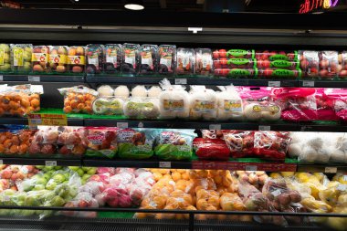 KUALA LUMPUR, MALAYSIA - DECEMBER 01, 2023: fresh fruits and vegetables section in Star Grocer, a well-known supermarket in Bandar Sri Damansara offering fresh produce and groceries. clipart