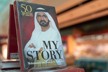 DUBAI, UAE - FEBRUARY 21, 2019: close up shot of My Story: 50 Memories from 50 Years of Service on display at Dubai International Airport. clipart