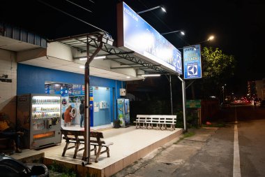 KOTA BHARU, MALAYSIA - NOVEMBER 19, 2023: self-service laundry in Kota Bharu. clipart