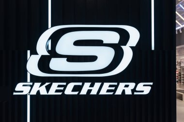 JOHOR BAHRU, MALAYSIA - NOVEMBER 23, 2023: close-up shot of the Skechers sign as seen at a Skechers store in a shopping mall in Johor Bahru. clipart