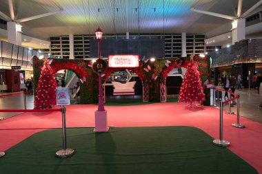 KUALA LUMPUR, MALAYSIA - NOVEMBER 28, 2023: Christmas decorations in Kuala Lumpur International Airport, Terminal 2. Christmas is a holiday known for its festive decor and lights. clipart