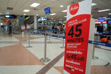 CHIANG MAI, THAILAND - OCTOBER 26, 2023: AirAsia check-in area in Chiang Mai International Airport. clipart