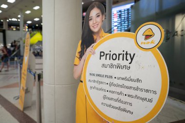 CHIANG MAI, THAILAND - OCTOBER 26, 2023: air hostess cardboard cutout as seen at Nok Air check-in area in Chiang Mai International Airport. clipart