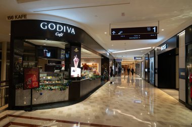 KUALA LUMPUR, MALAYSIA - DECEMBER 02, 2023: Godiva Cafe in Suria KLCC. Godiva is a prestigious chocolatier known for its premium chocolates and indulgent treats. clipart