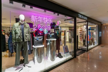 Hong Kong, China - February 02, 2019: dressed mennequins displayed at a Trussardi store in Hong Kong. Trussardi is an Italian fashion house. clipart