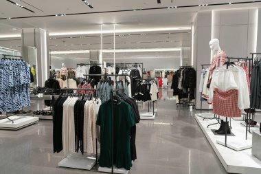 Shenzhen, China - February 06, 2019: interior of a Zara store in UpperHills shopping mall. Zara is a Spanish retailer offering clothing, footwear, and accessories for men, women, and children. clipart