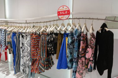 Shenzhen, China - February 06, 2019: clothes displayed at the Grace Deng store in UpperHills shopping mall clipart