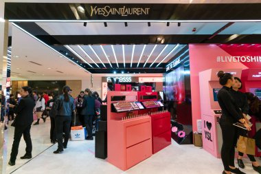 Hong Kong, China - February 02, 2019: YSL beauty space at Harbour City, Hong Kong, showcasing makeup, skincare, and fragrance products. clipart