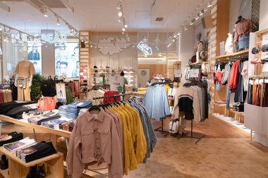 Shenzhen, China - February 06, 2019: interior shot of a Pull and Bear store in UpperHills mall. Pull and Bear is a Spanish brand offering clothing and accessories for men and women. clipart