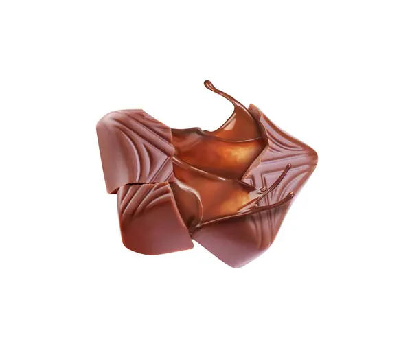 白色背景的巧克力糖果 带有巧克力水花 图库图片