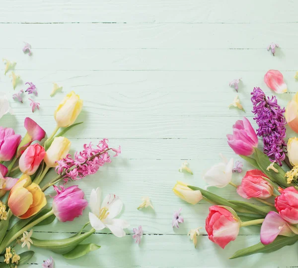 stock image spring flowers on green wooden background