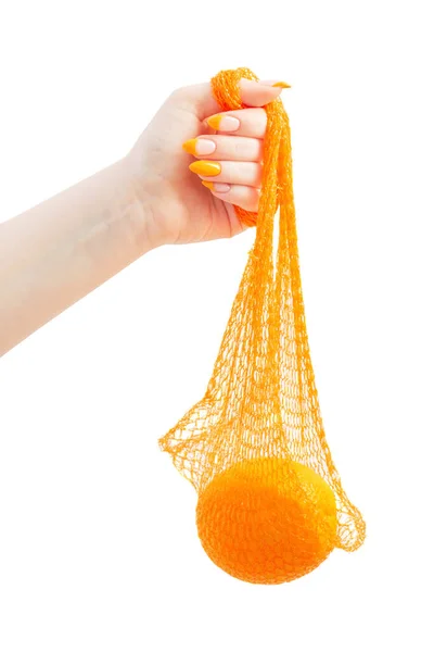Женская Рука Оранжевым Синтетическим Мешком Белом Фоне — стоковое фото