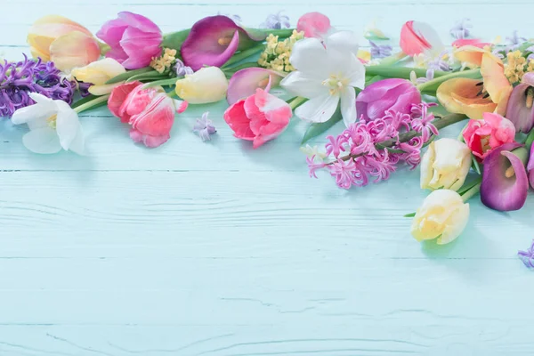 stock image spring flowers on white wooden background