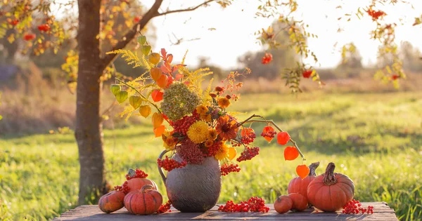 Bouquet Autumn Flowers Rustic Jug Wooden Table Outdoor Sunset — Stock Photo, Image