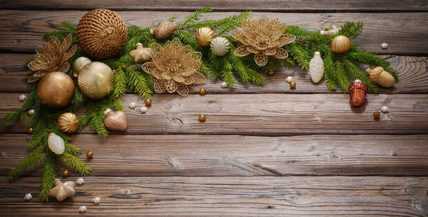 Golden Christmas Toys Fir Branches Dark Wooden Background — Stock Photo, Image