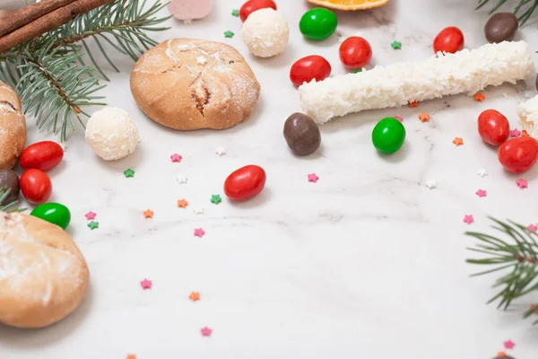 Candies Cookies Christmas Tree Branches White Marble Background — Stock Photo, Image