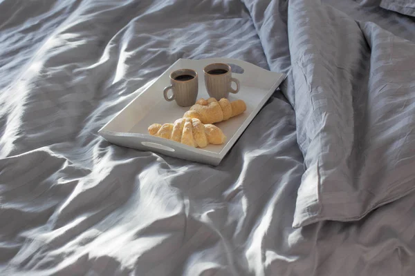 Two Croissants Two Cups Coffee Bed — Stockfoto