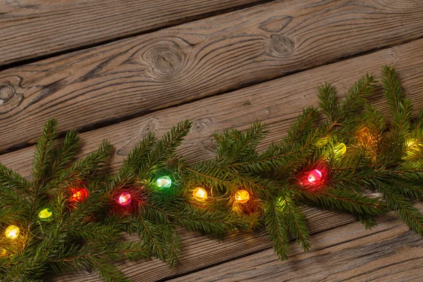 Kleurrijke Kerstverlichting Donkere Houten Achtergrond — Stockfoto