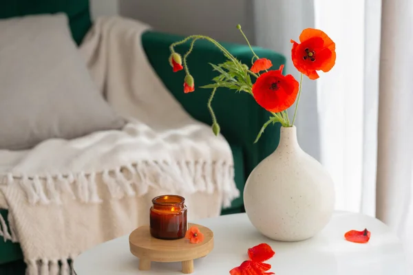 cozy home interior with flowers and burning candles