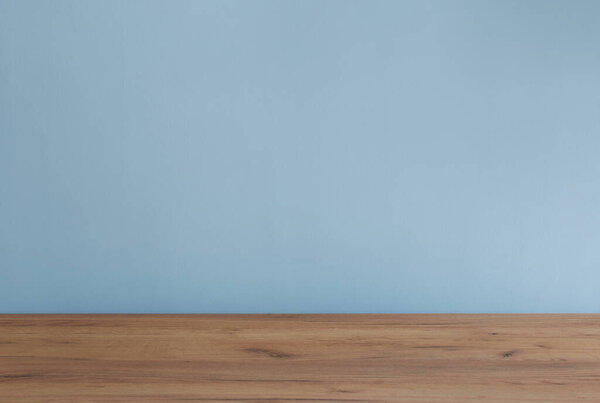 background with modern wooden table and blue  wall