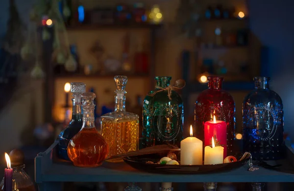 magic potions in  witch\'s house with burning candles at night