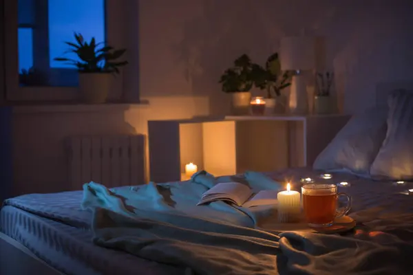 Cup Tea Burning Candle Wooden Tray Bed Bedroom Evening — Fotografia de Stock