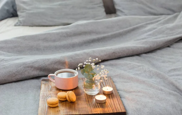 Cup Tea Macaroons Candles Wooden Tray Bed — Stock Photo, Image