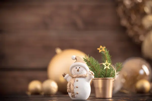 Christmas Golden Decorations Snowman Dark Wooden Background Stock Photo