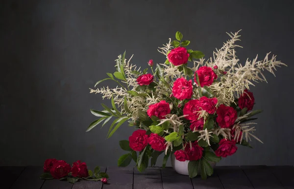 bouquet of red roses on background black wall