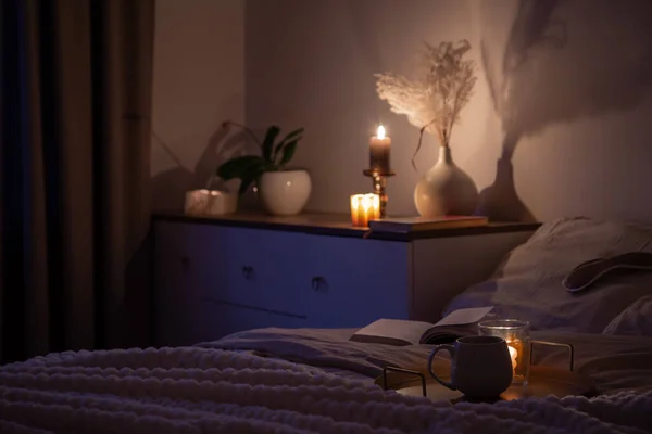 cup of tea in bedroom at night