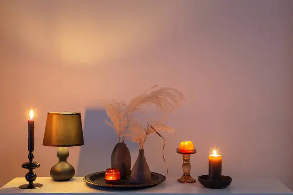 home decor with dried flowers and burning candles