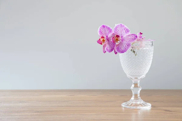 Purple Orchid Glass Wooden Table — Stock Photo, Image