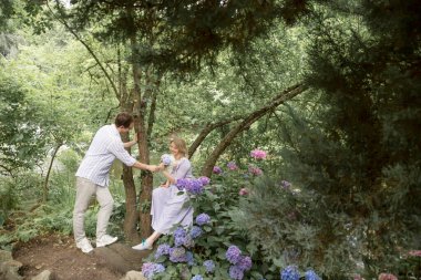 portrait of happy couple in summer park