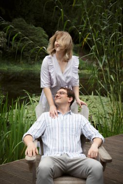 portrait of happy couple in summer park
