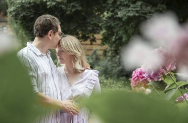 portrait of happy couple in summer park