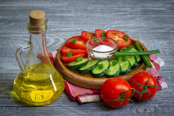 Stock image Sunflower oil for fresh vegetables salad cooking. Rustic style wooden table and utensil.