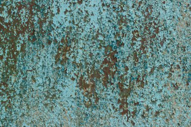 Paslı ve çatlak boyalı eski metalik bir yüzey. Soyut arkaplan.