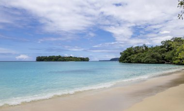 Port Olry is a rustic blue waters beach on the picturesque coast of Espiritu Santo, Vanuatu largest island clipart