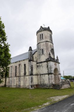 View of the Cemetery  of Easo, next to the Church of St Francis Xavier, in Lifou Island, Loyalty Islands, New Caledonia, South Pacific  clipart