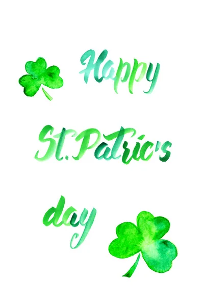 Hand drawn watercolor illustration for Saint Patrick\'s Day greeting card. Irish festival celebration design. Shamrock trefoil leaves symbol and text in green isolated over white.